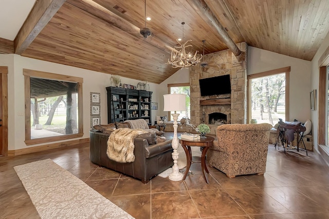 living room featuring an inviting chandelier, wood ceiling, beam ceiling, and a stone fireplace