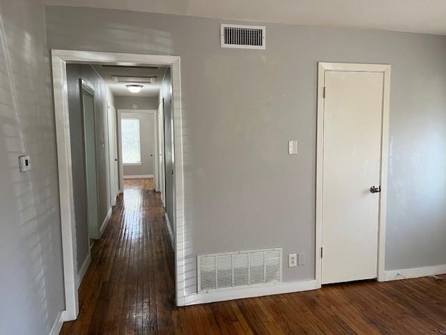 hall with dark hardwood / wood-style flooring