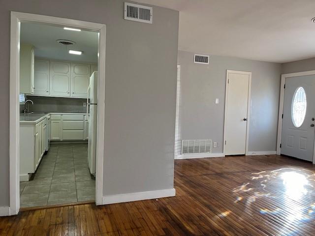 entryway featuring wood-type flooring and sink