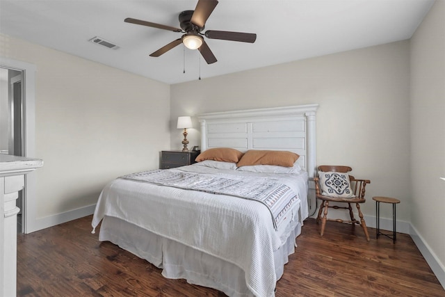 bedroom with ceiling fan and dark hardwood / wood-style floors