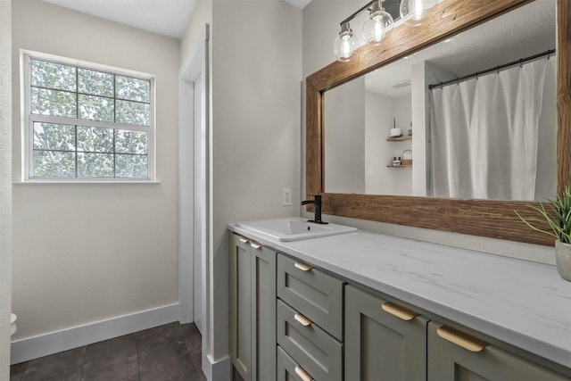 bathroom with vanity and tile patterned floors