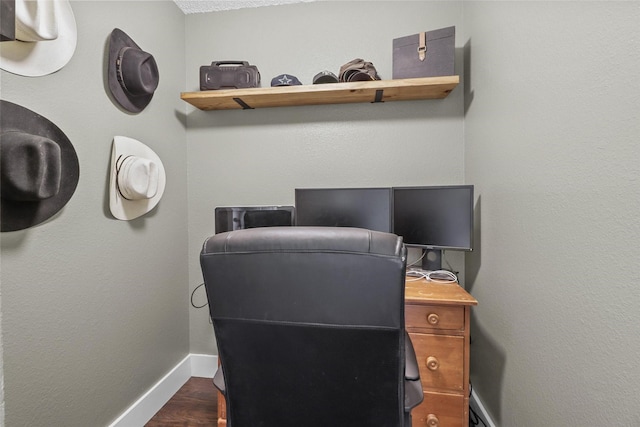 office featuring dark hardwood / wood-style floors and a textured ceiling