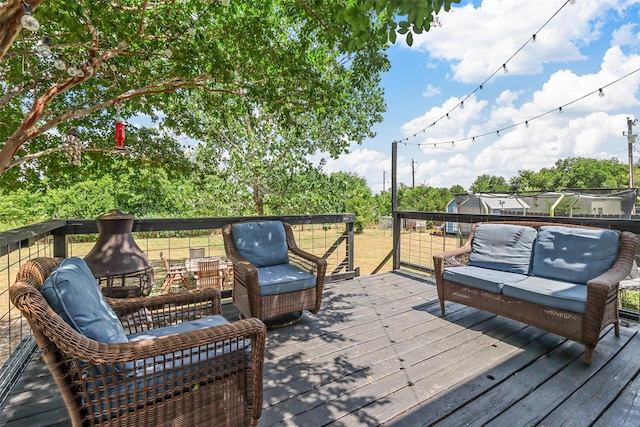 wooden deck featuring an outdoor living space