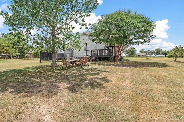 view of yard featuring a wooden deck