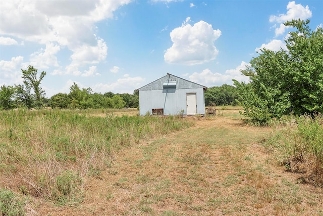 view of outdoor structure featuring a rural view