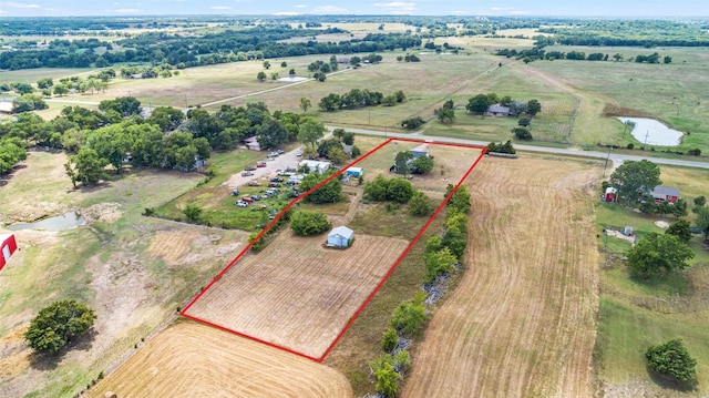 aerial view with a water view and a rural view