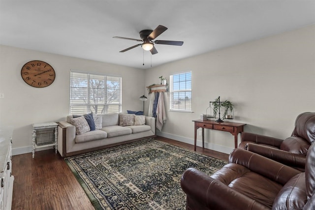 living room featuring ceiling fan and dark hardwood / wood-style floors