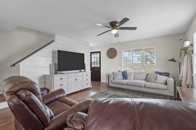 living room with dark hardwood / wood-style floors and ceiling fan