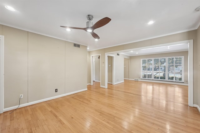 unfurnished room with crown molding, ceiling fan, and light hardwood / wood-style floors