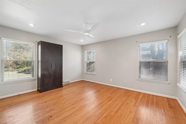 unfurnished bedroom featuring ceiling fan and light hardwood / wood-style flooring