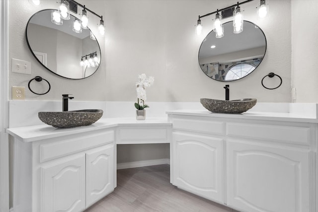 bathroom featuring hardwood / wood-style flooring and vanity