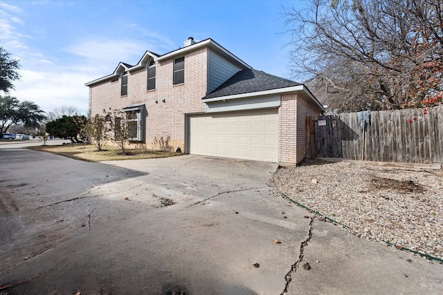 view of property exterior with a garage