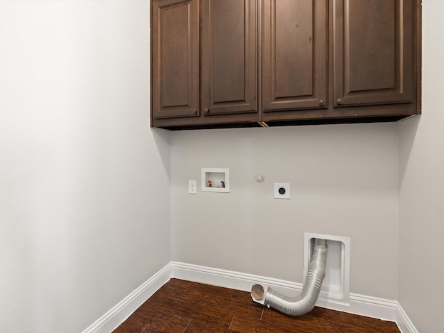 laundry room featuring hookup for a gas dryer, hookup for an electric dryer, washer hookup, baseboards, and cabinet space