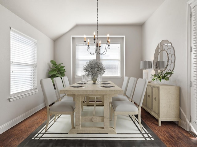 dining area featuring a chandelier, vaulted ceiling, dark wood finished floors, and baseboards