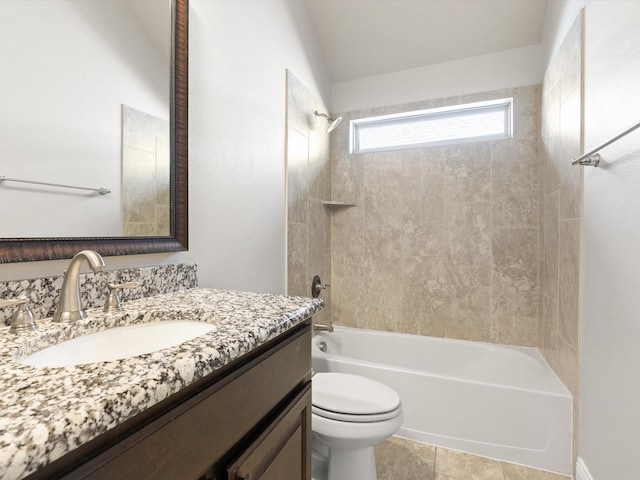 full bathroom with tiled shower / bath, vanity, toilet, and tile patterned flooring