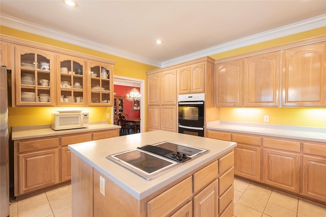 kitchen with white microwave, double wall oven, black electric stovetop, light tile patterned flooring, and glass insert cabinets