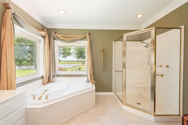 bathroom featuring a bath, a stall shower, tile patterned floors, vanity, and crown molding