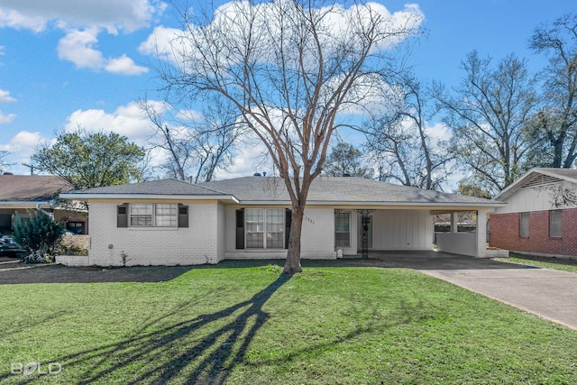 ranch-style house featuring a front yard and a carport