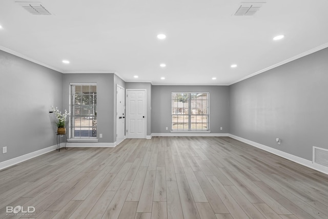 unfurnished living room featuring crown molding and light hardwood / wood-style floors