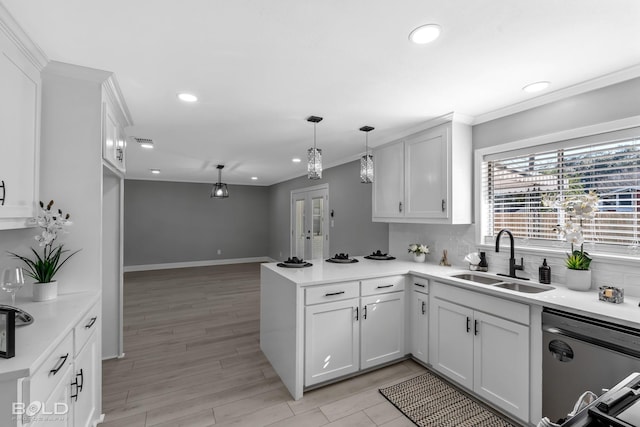 kitchen featuring white cabinetry, sink, and dishwasher