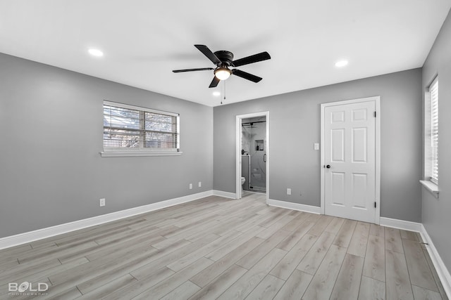 unfurnished bedroom with ensuite bath, ceiling fan, and light hardwood / wood-style floors