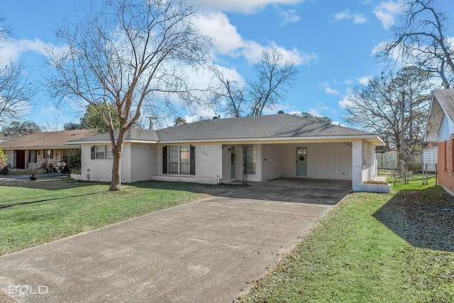 single story home featuring a front yard and a carport