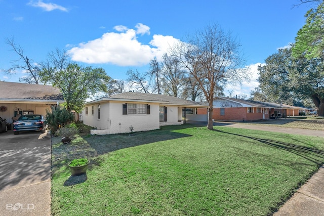 ranch-style home with a carport and a front lawn