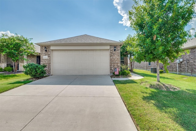 view of front of home featuring a garage, central AC, and a front yard