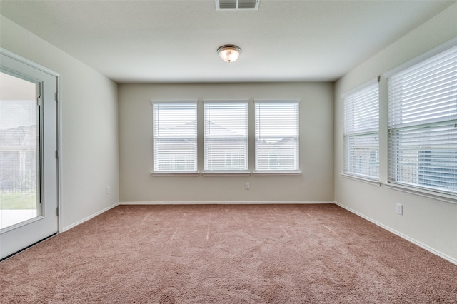 unfurnished room with light carpet