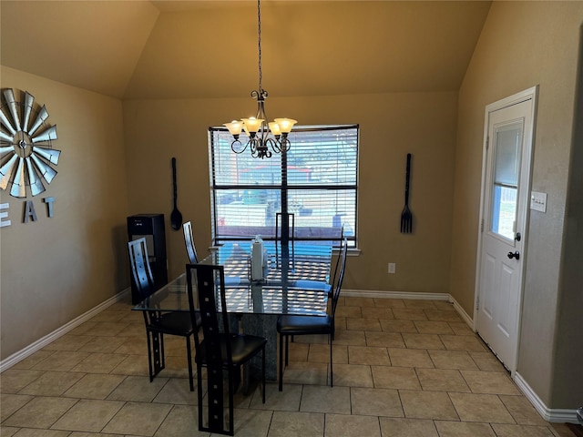 tiled dining space with an inviting chandelier and lofted ceiling