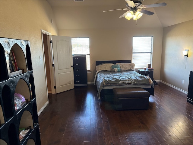 bedroom with dark wood-type flooring, ceiling fan, and vaulted ceiling