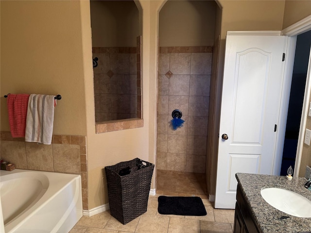 bathroom with vanity, tile patterned floors, and plus walk in shower