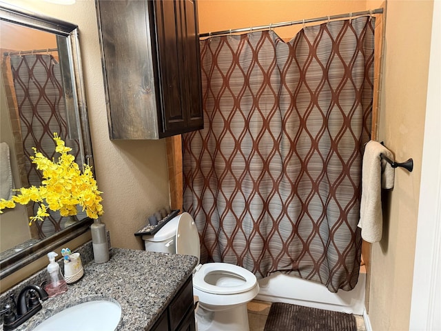 full bathroom with vanity, shower / bath combination with curtain, and toilet