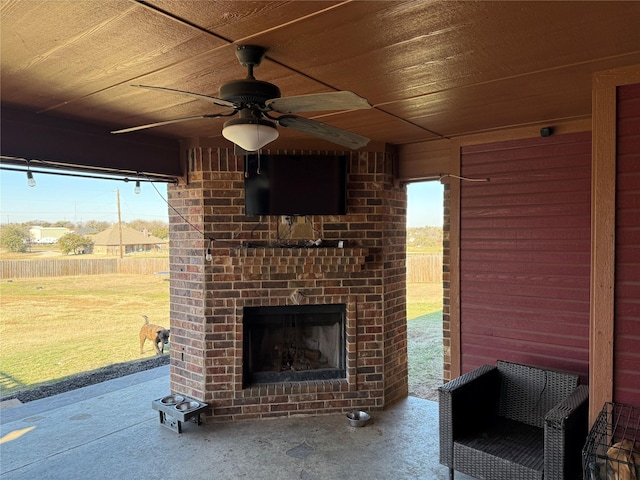 view of patio / terrace with an outdoor brick fireplace