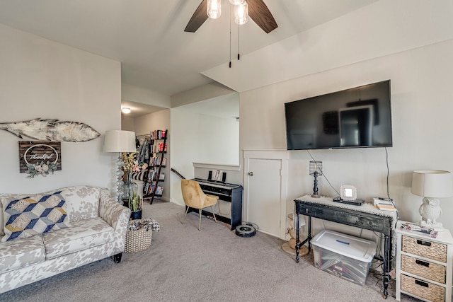 carpeted living room featuring ceiling fan