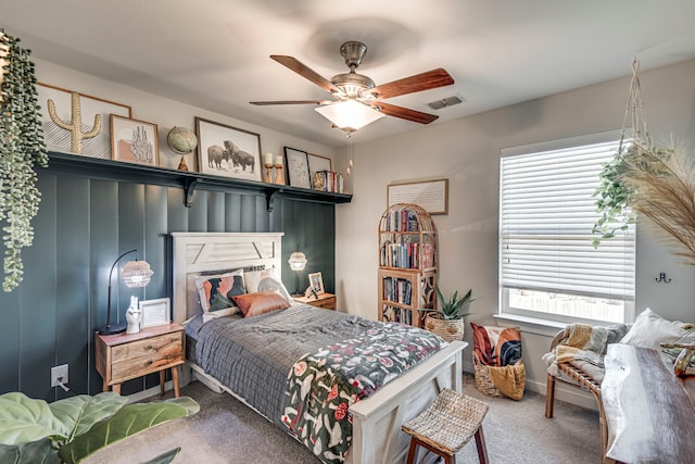 bedroom with baseboards, ceiling fan, carpet, and visible vents