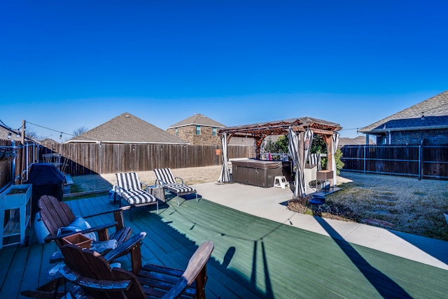 deck featuring a gazebo and a hot tub