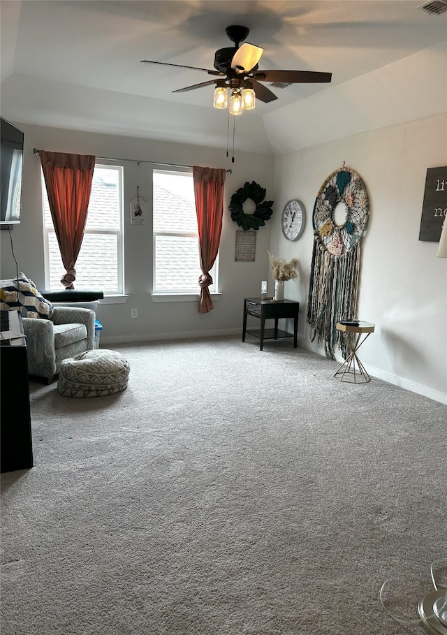 sitting room with ceiling fan, visible vents, baseboards, and carpet