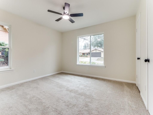 carpeted empty room with ceiling fan