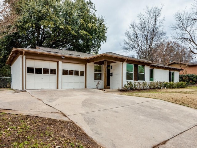 single story home featuring a garage