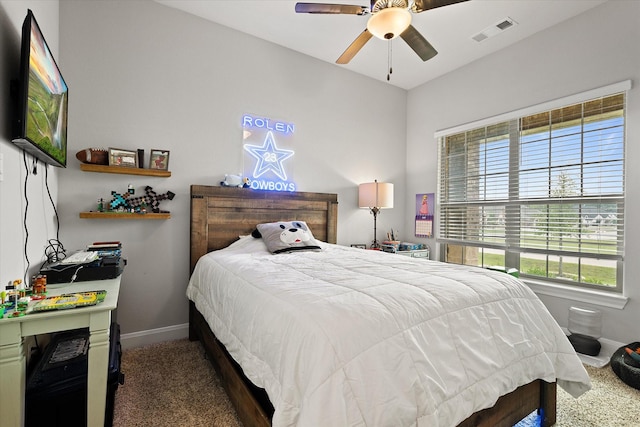 bedroom with dark colored carpet and ceiling fan