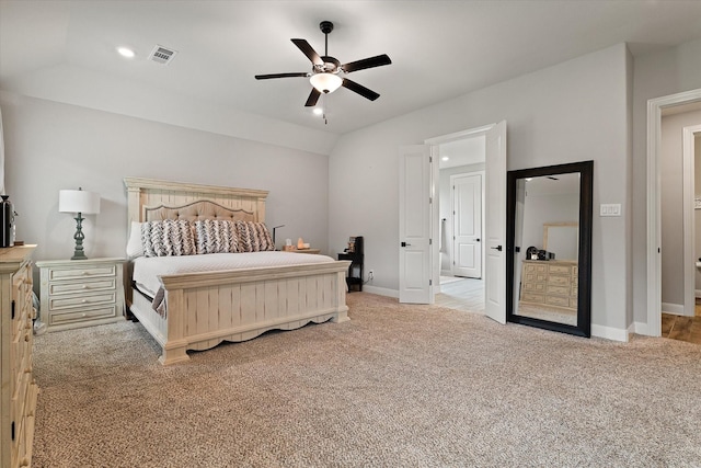 carpeted bedroom with ceiling fan and lofted ceiling