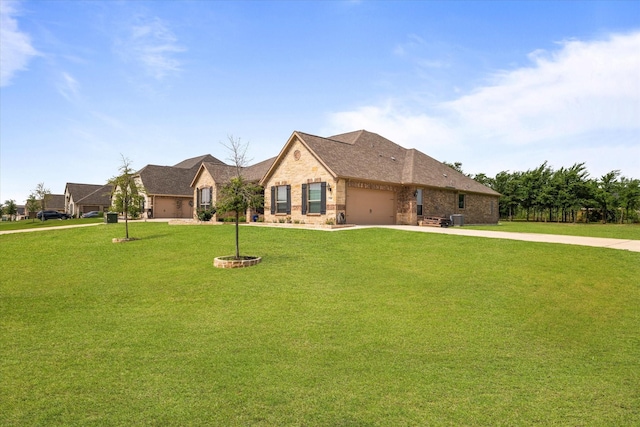 view of front of house with a garage and a front yard