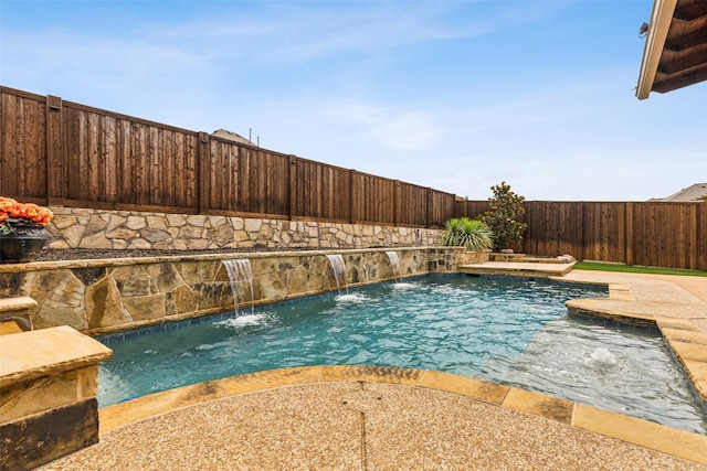 view of swimming pool with pool water feature