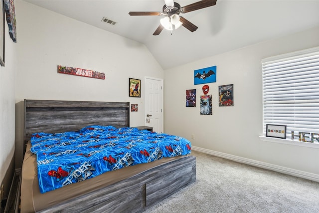 carpeted bedroom featuring ceiling fan and vaulted ceiling