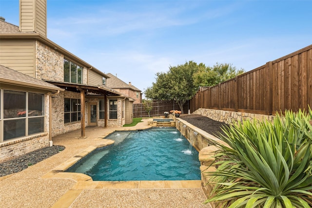 view of pool with pool water feature and a patio