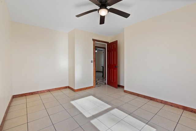 tiled empty room with ceiling fan