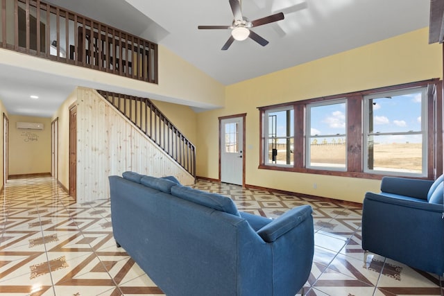 tiled living room with a wall mounted air conditioner and ceiling fan