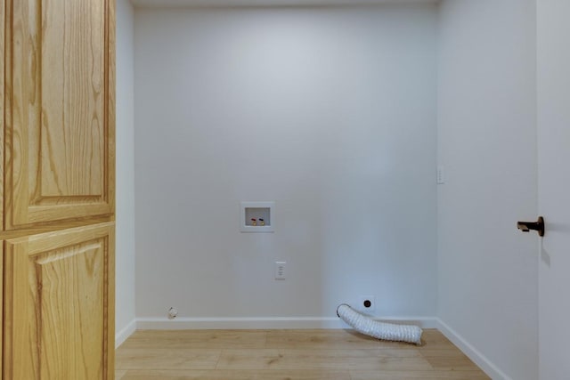 laundry area featuring hookup for a washing machine, electric dryer hookup, and light hardwood / wood-style flooring