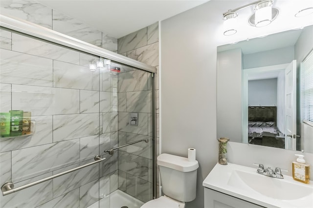 bathroom featuring vanity, toilet, and walk in shower